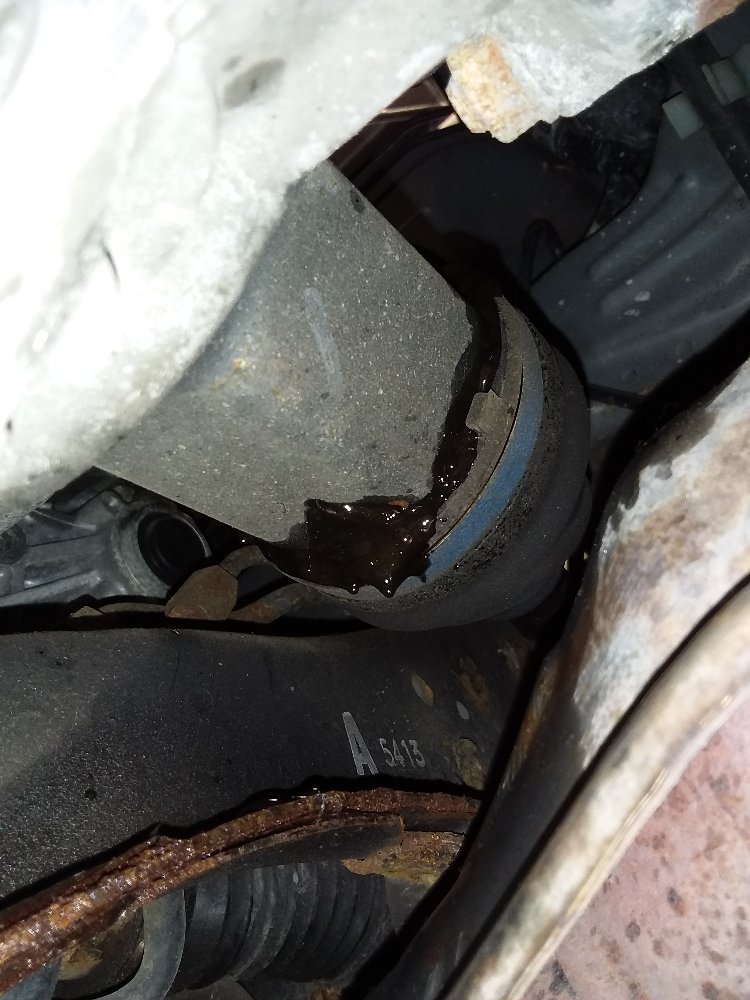Damaged Subaru drive axle CV-joint caused by failure of the front control arm due to rust.