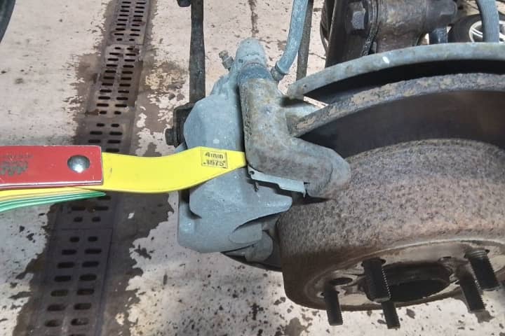 Measuring minimum brake pad thickness on 2008 Toyota Avalon