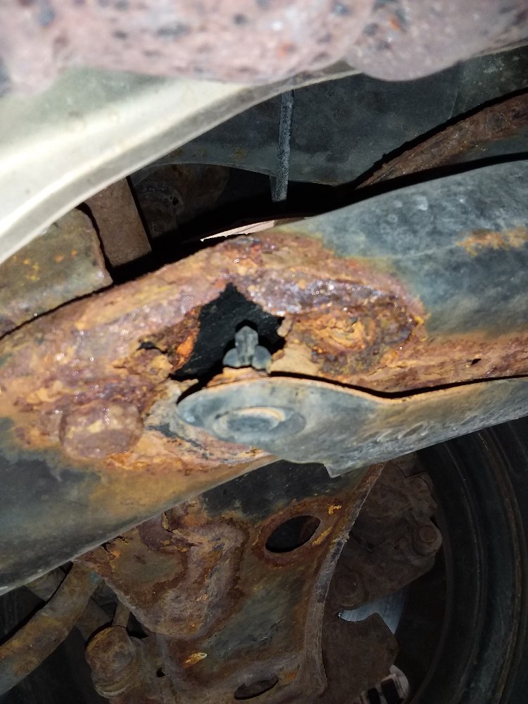 Subaru rust damaged front suspension control arm